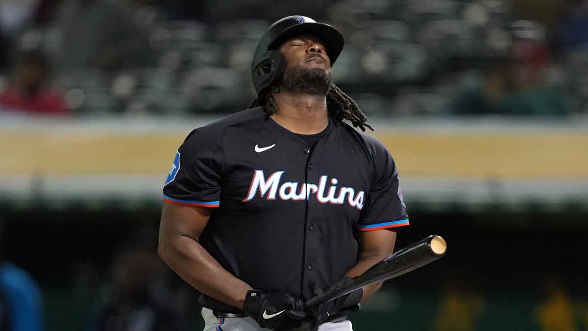 Miami Marlins designated hitter Josh Bell (9) reacts after being hit by a pitch against the Oakland Athletics during the eighth inning at Oakland-Alameda County Coliseum.