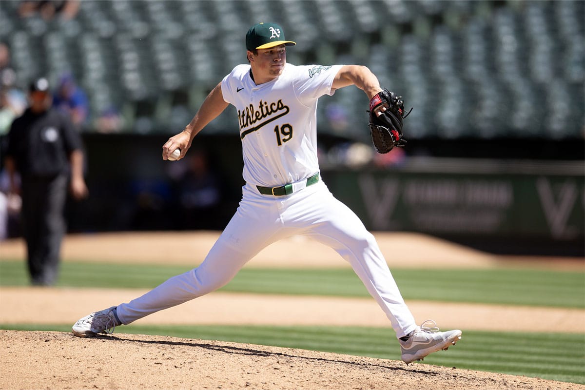 Oakland Athletics pitcher Mason Miller (19) delivers a pitch against the Texas Rangers during the eighth inning at Oakland-Alameda County Coliseum.