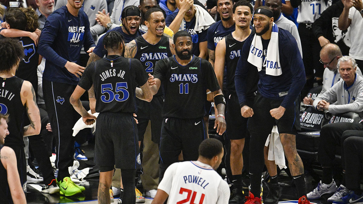Dallas Mavericks guard Kyrie Irving (11) celebrates with his teammates after he makes a three point shot and is fouled by LA Clippers forward P.J. Tucker (not pictured) during the fourth quarter during game six of the first round for the 2024 NBA playoffs at American Airlines Center