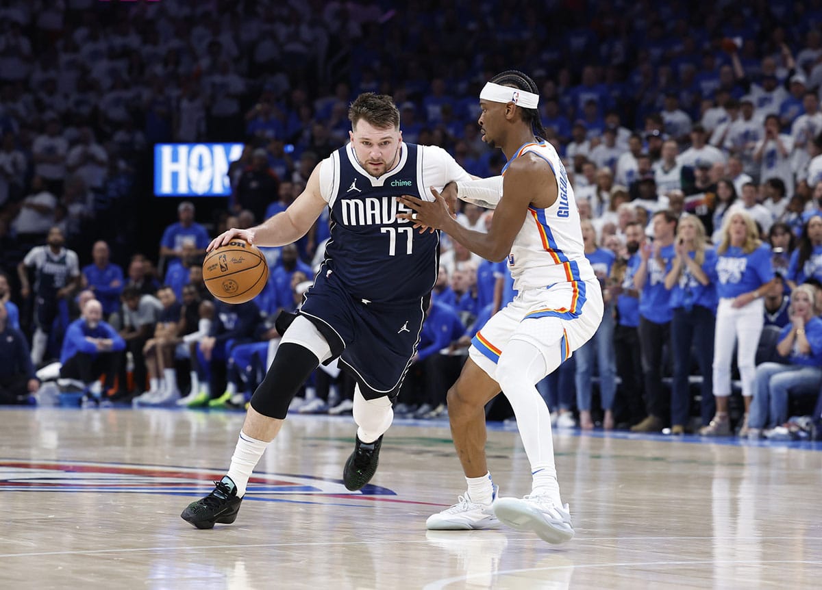 Mavericks guard Luka Doncic (77) drives to the basket around Oklahoma City Thunder guard Shai Gilgeous-Alexander (2)