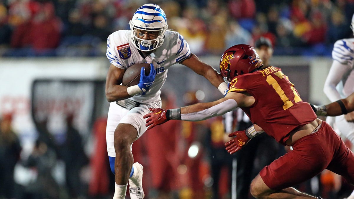 Memphis Tigers running back Blake Watson (4) runs the ball as Iowa State Cyclones defensive back Beau Freyler (17) makes the tackle during the second half at Simmons Bank Liberty Stadium. 