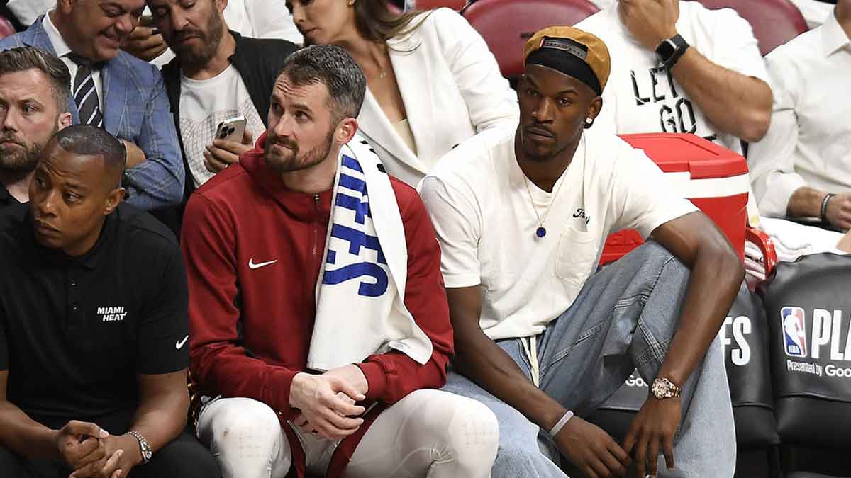 Apr 29, 2024; Miami, Florida, USA; Miami Heat forward Kevin Love (42) and Jimmy Butler (22) watch the Heat fall to the Boston Celtics during the fourth quarter of game four of the first round for the 2024 NBA playoffs at Kaseya Center. Mandatory Credit: Michael Laughlin-USA TODAY Sports