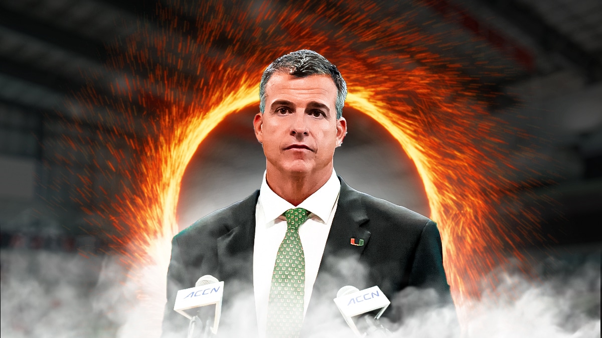 Miami football's head coach Mario Cristobal in front of transfer portal