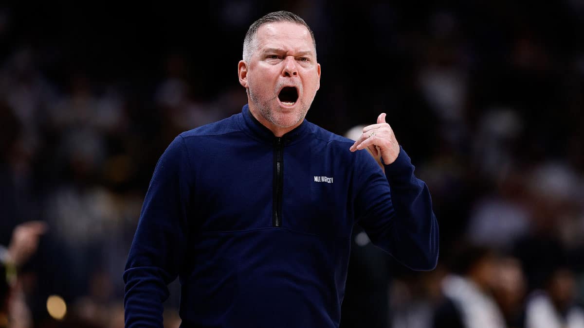 Denver Nuggets head coach Michael Malone gestures in the third quarter against the Los Angeles Lakers during game five of the first round for the 2024 NBA playoffs at Ball Arena. 