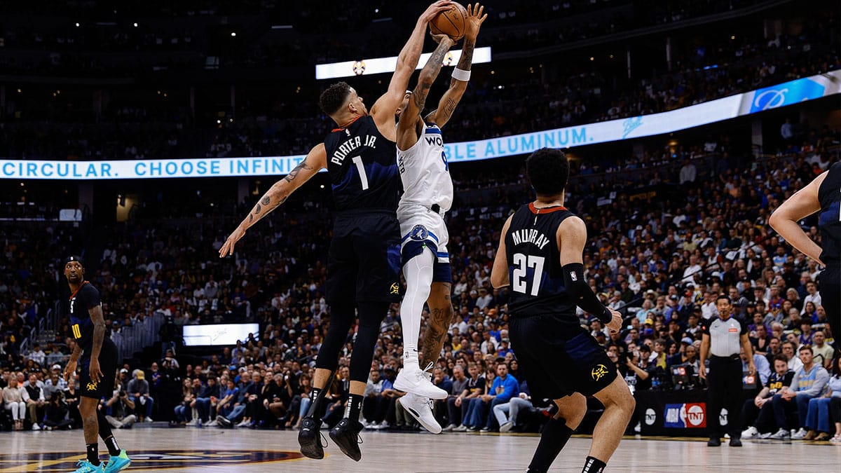 Denver Nuggets forward Michael Porter Jr. (1) blocks the shot of Minnesota Timberwolves guard Nickeil Alexander-Walker (9) as guard Jamal Murray (27) looks on in the first quarter during game five of the second round for the 2024 NBA playoffs at Ball Arena. 