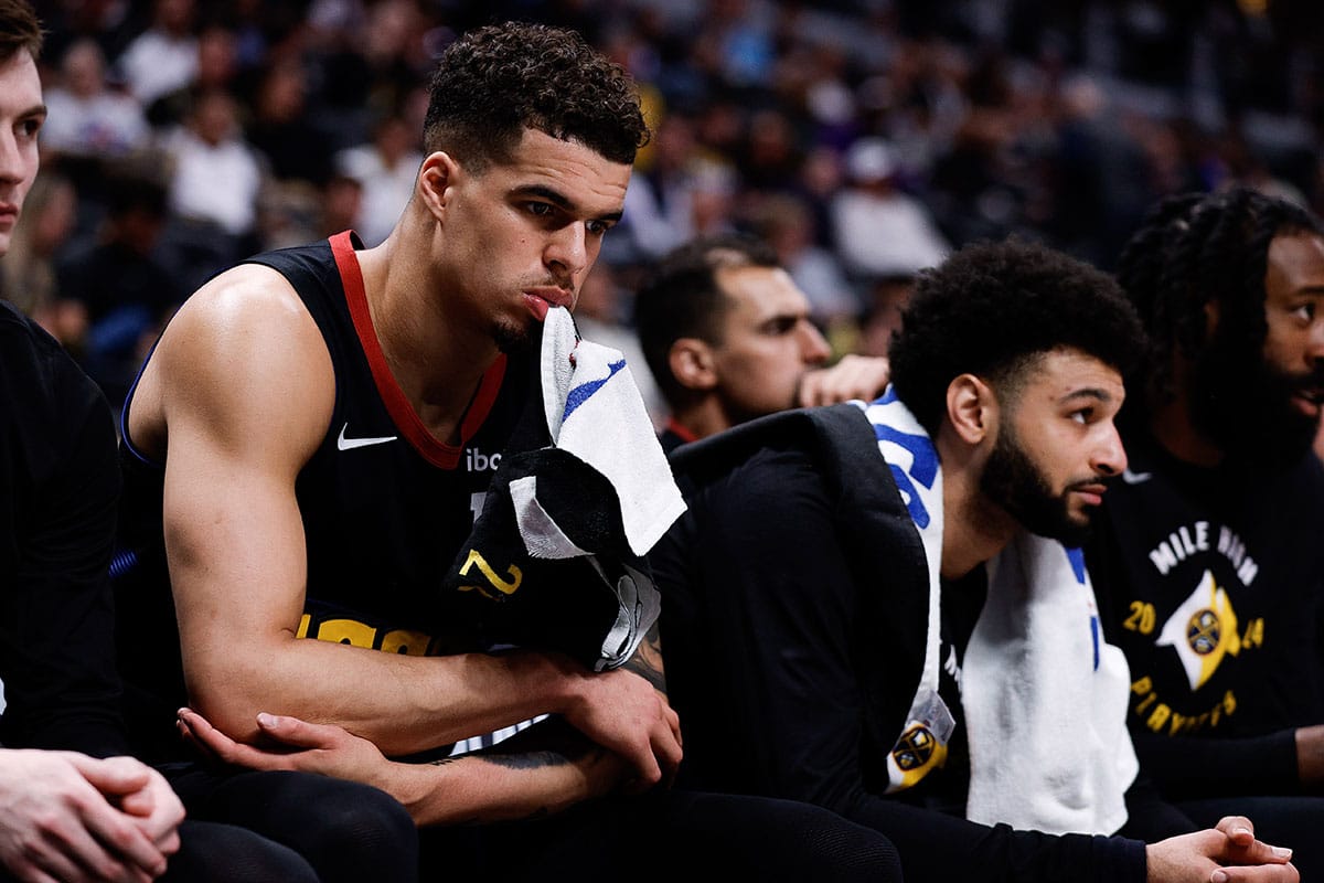 Denver Nuggets forward Michael Porter Jr. (1) and guard Jamal Murray (27) on the bench in the fourth quarter against the Minnesota Timberwolves during game two of the second round for the 2024 NBA playoffs at Ball Arena.