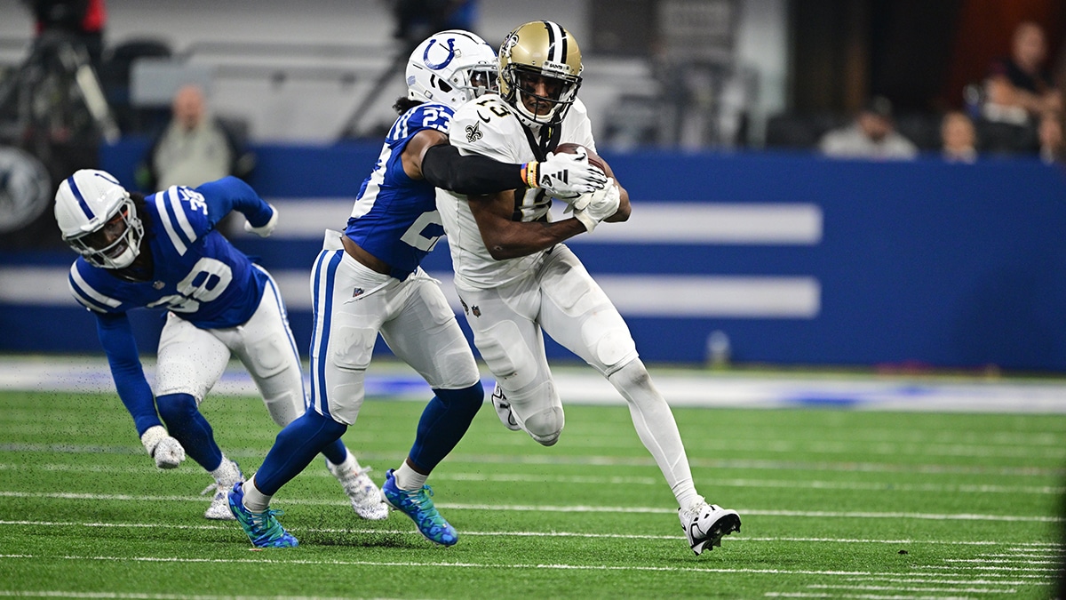 New Orleans Saints wide receiver Michael Thomas (13) is tackled by Indianapolis Colts cornerback Kenny Moore II (23) during the first quarter at Lucas Oil Stadium. 
