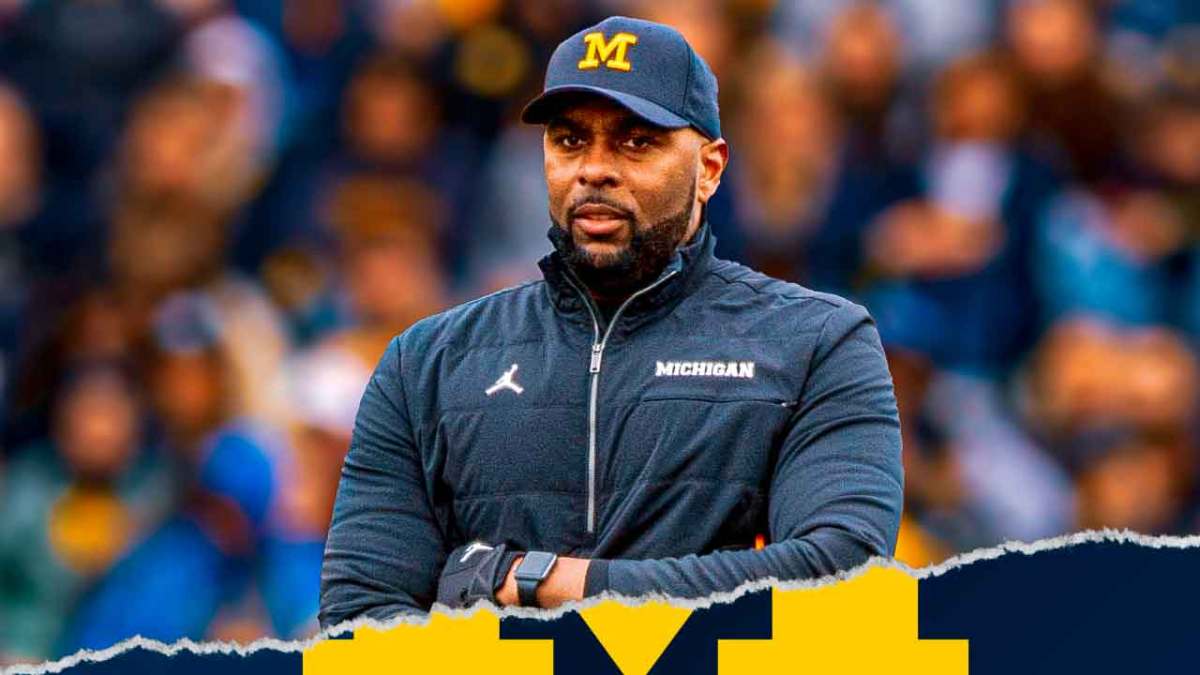 Michigan football, Sherrone Moore, Sherrone Moore Michigan football, Sherrone Moore speech, Wolverines, Sherrone Moore with fire behind him, Michigan football stadium in the background