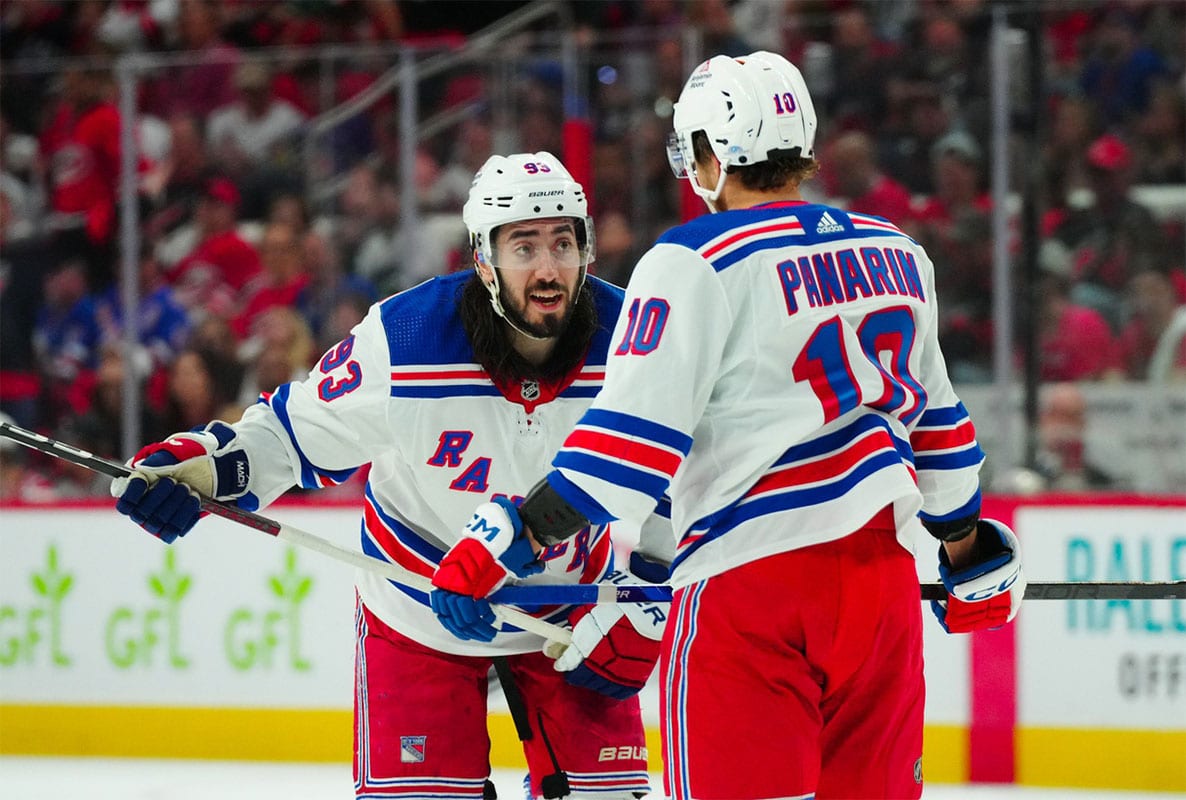 New York Rangers center Mika Zibanejad (93) and left wing Artemi Panarin (10) talks against the Carolina Hurricanes during the second period in game three of the second round of the 2024 Stanley Cup Playoffs at PNC Arena