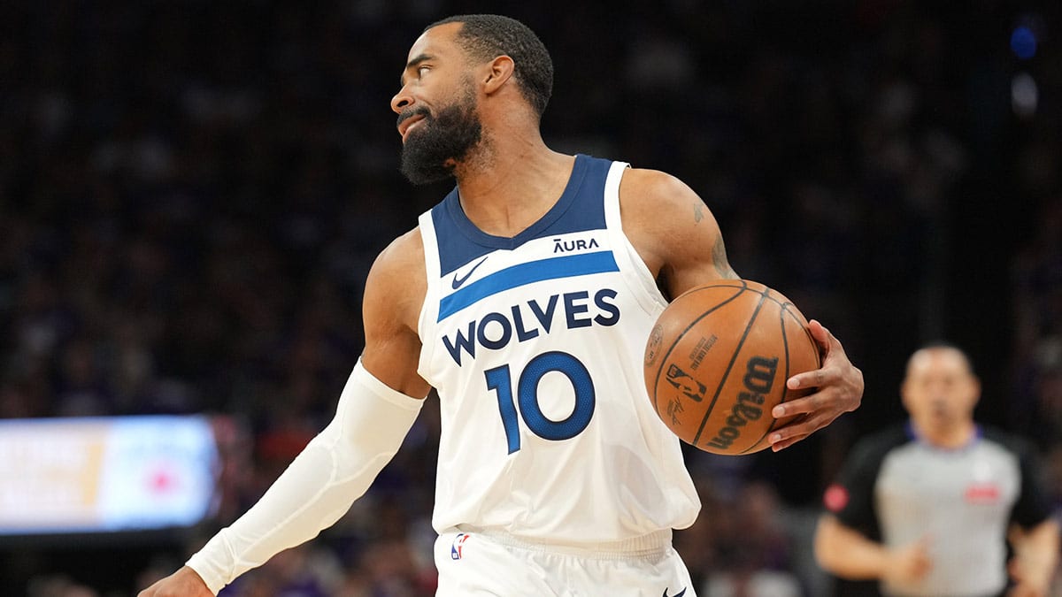 Minnesota Timberwolves guard Mike Conley (10) dribbles against the Phoenix Suns during the first half of game four of the first round for the 2024 NBA playoffs at Footprint Center.