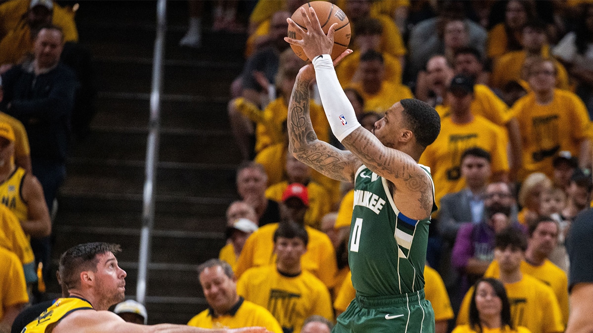 May 2, 2024; Indianapolis, Indiana, USA; Milwaukee Bucks guard Damian Lillard (0) shoots the ball while Indiana Pacers guard T.J. McConnell (9) defends during game six of the first round for the 2024 NBA playoffs at Gainbridge Fieldhouse. Mandatory Credit: Trevor Ruszkowski-USA TODAY Sports