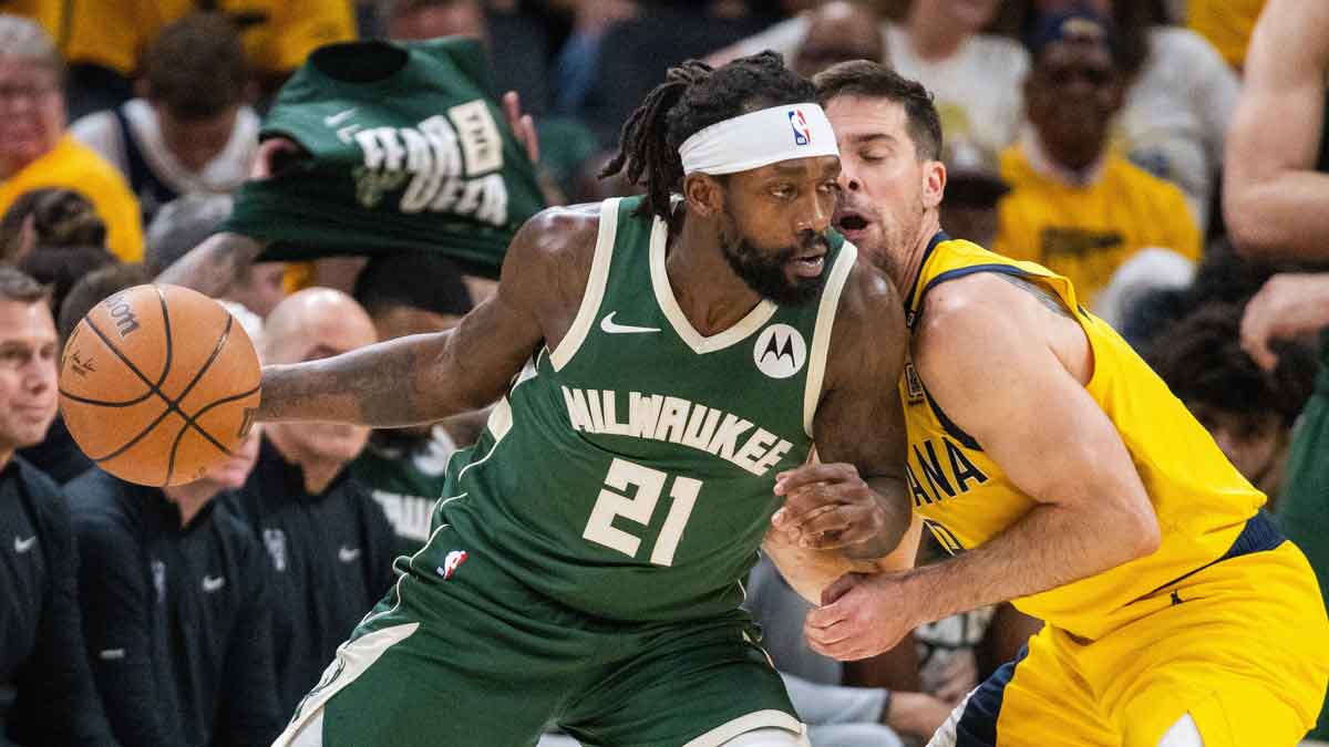 May 2, 2024; Indianapolis, Indiana, USA; Milwaukee Bucks guard Patrick Beverley (21) dribbles the ball while Indiana Pacers guard T.J. McConnell (9) defends during game six of the first round for the 2024 NBA playoffs at Gainbridge Fieldhouse. Mandatory Credit: Trevor Ruszkowski-USA TODAY Sports