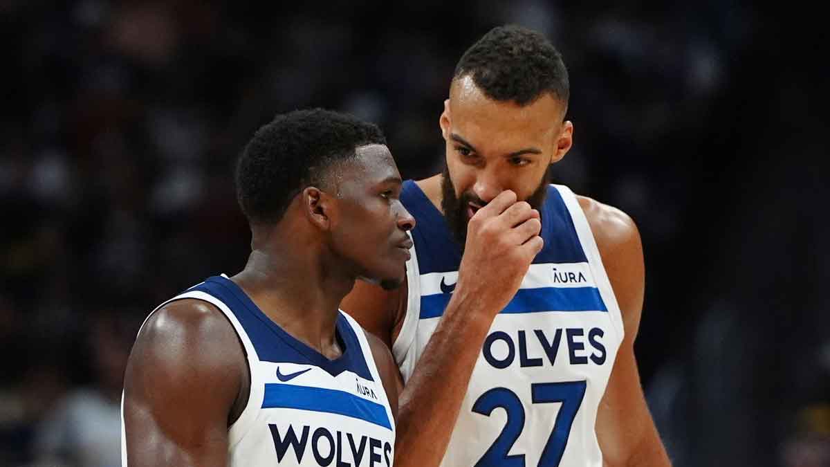 May 4, 2024; Denver, Colorado, USA; Minnesota Timberwolves guard Anthony Edwards (5) and center Rudy Gobert (27) during the second half against the Denver Nuggets during game one of the second round for the 2024 NBA playoffs at Ball Arena. Mandatory Credit: Ron Chenoy-USA TODAY Sports