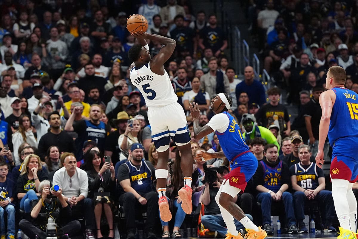 Minnesota Timberwolves guard Anthony Edwards (5) shoots the ball over Denver Nuggets guard Kentavious Caldwell-Pope (5) in the fourth quarter during game one of the second round for the 2024 NBA playoffs at Ball Arena. 