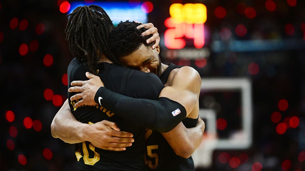 Cleveland Cavaliers guard Donovan Mitchell (45) celebrates with guard Darius Garland