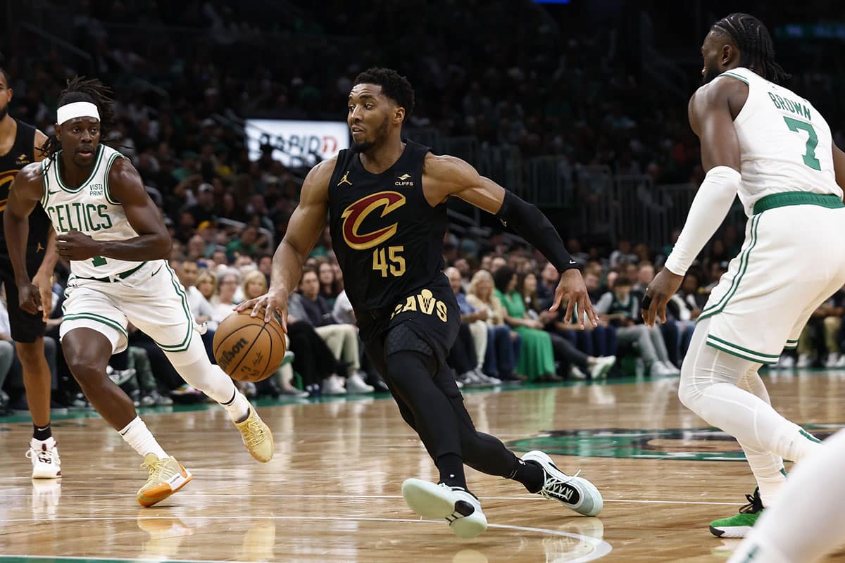 Cleveland Cavaliers guard Donovan Mitchell (45) weaves between the defense during the second quarter of game one of the second round of the 2024 NBA playoffs against the Boston Celtics at TD Garden.
