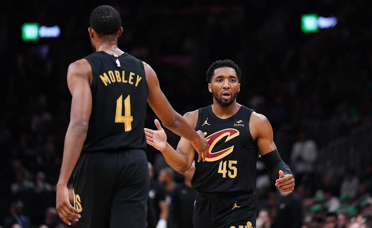 Cleveland Cavaliers guard Donovan Mitchell (45) reacts after a basket buy forward Evan Mobley (4) against the Boston Celtics in the first quarter during game two of the second round for the 2024 NBA playoffs at TD Garden. 