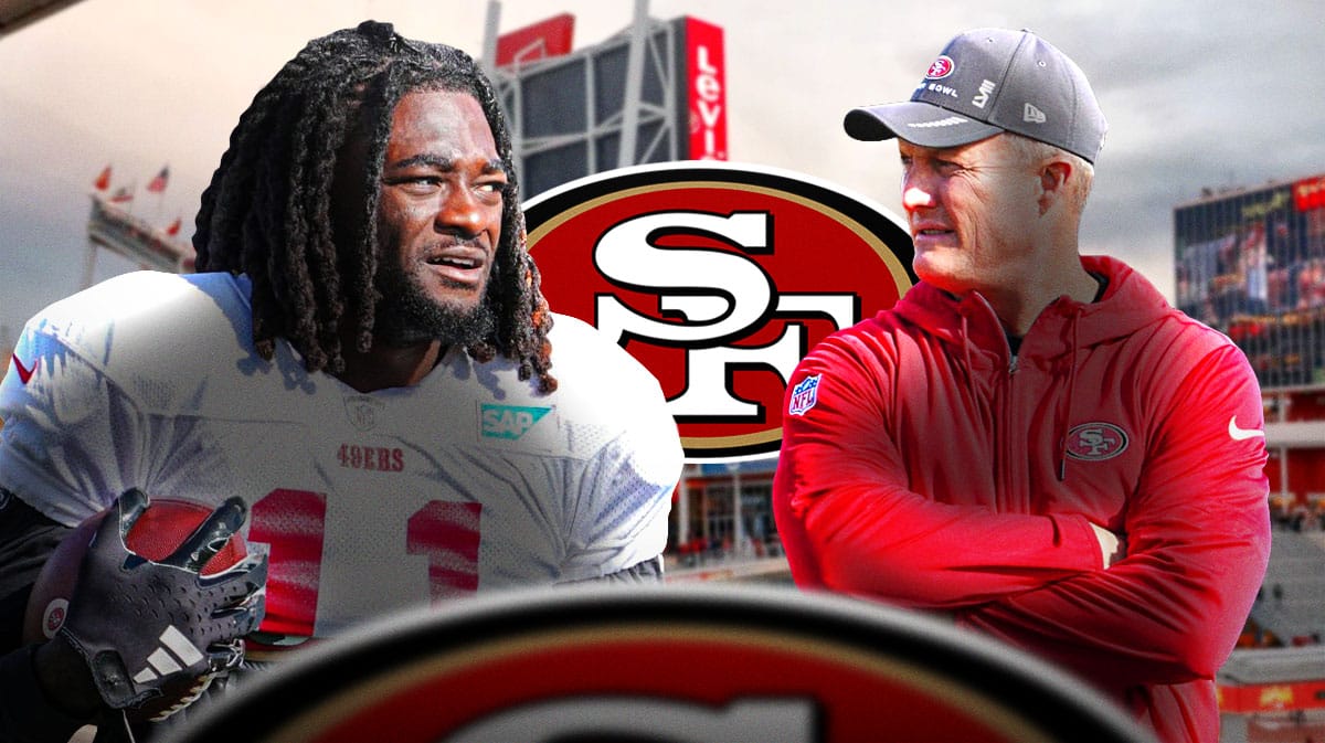49ers John Lynch looking at Brandon Aiyuk