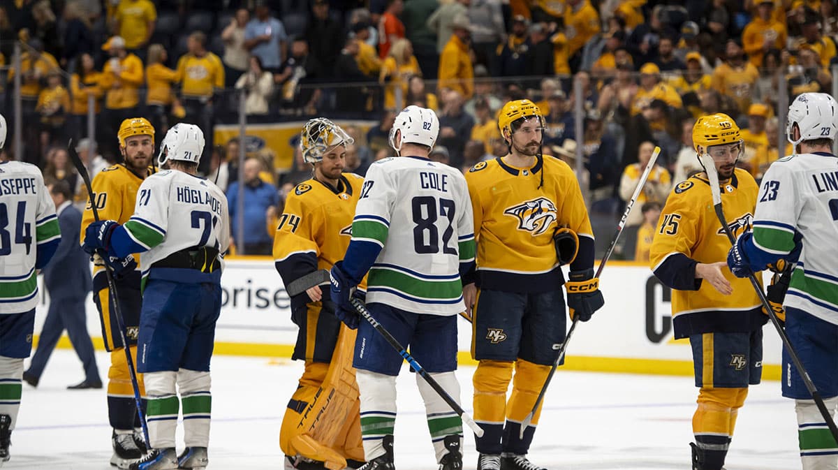 Nashville Predators and Vancouver Canucks shake hands at the end of the series after game six of the first round of the 2024 Stanley Cup Playoffs at Bridgestone Arena. 