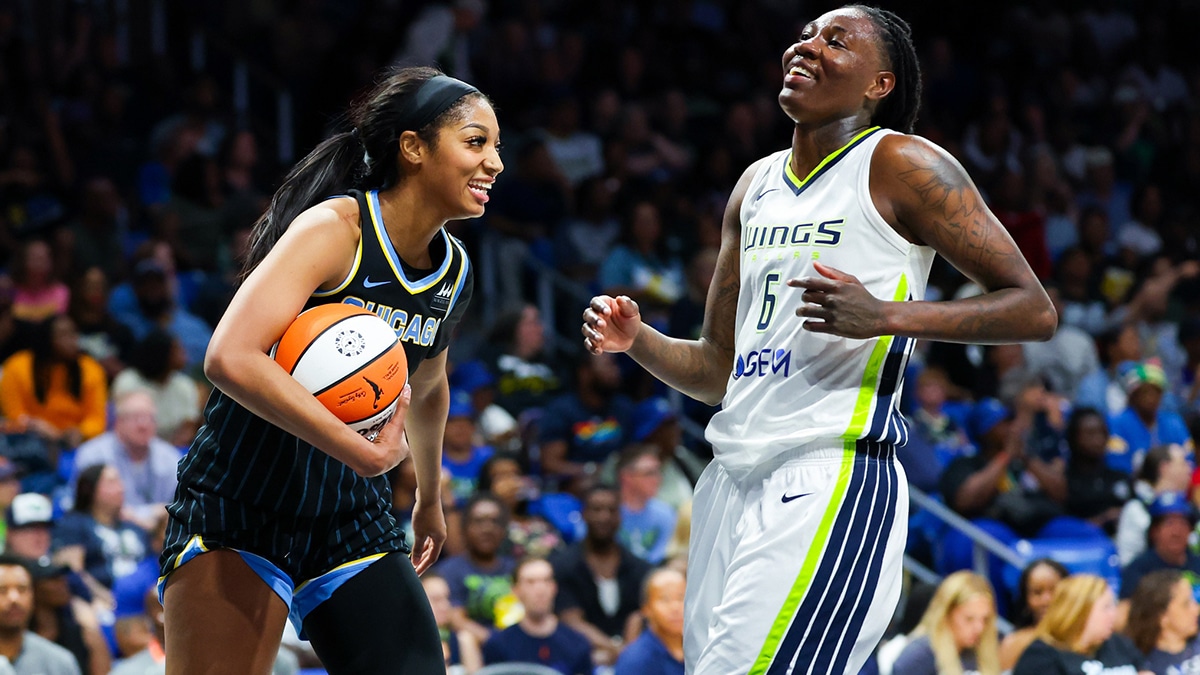 Chicago Sky forward Angel Reese (5) laughs with Dallas Wings forward Natasha Howard (6) during the second half at College Park Center.