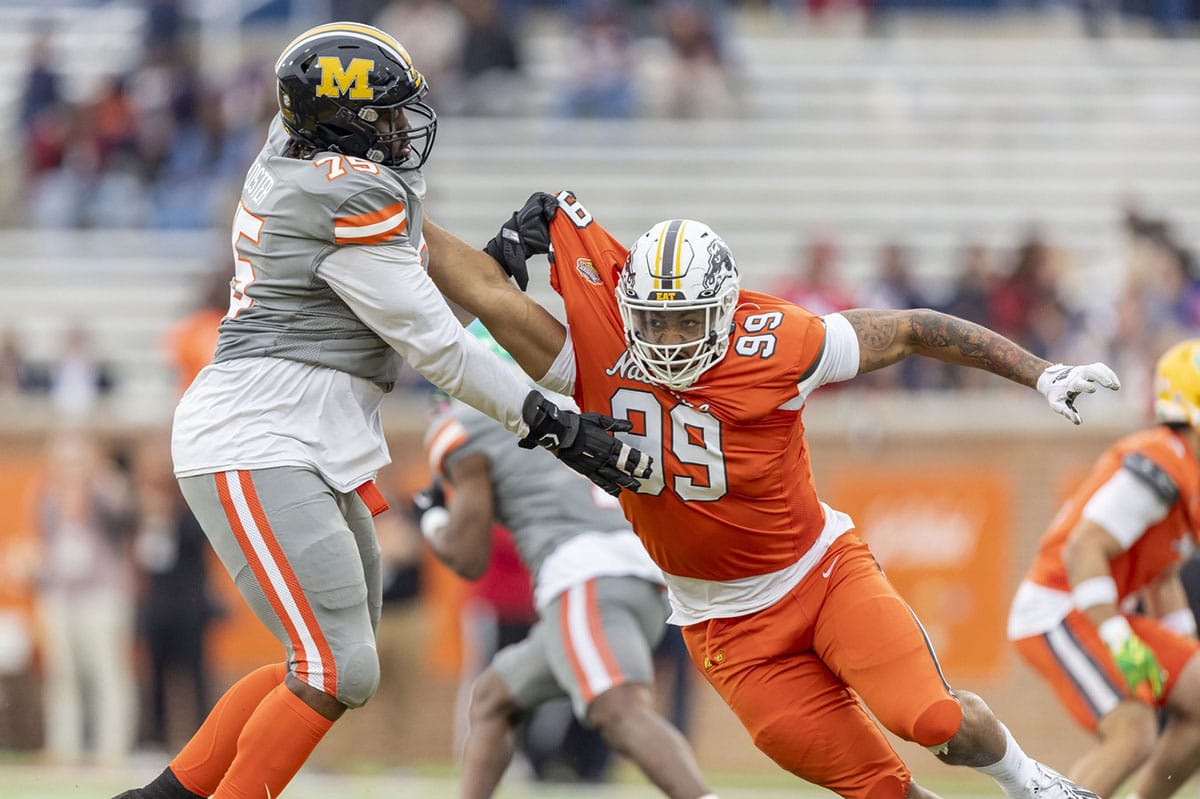 American offensive lineman Javon Foster of Missouri (75) battle National edge Marshawn Kneeland of Western Michigan (99) during the second half of the 2024 Senior Bowl football game at Hancock Whitney Stadium.