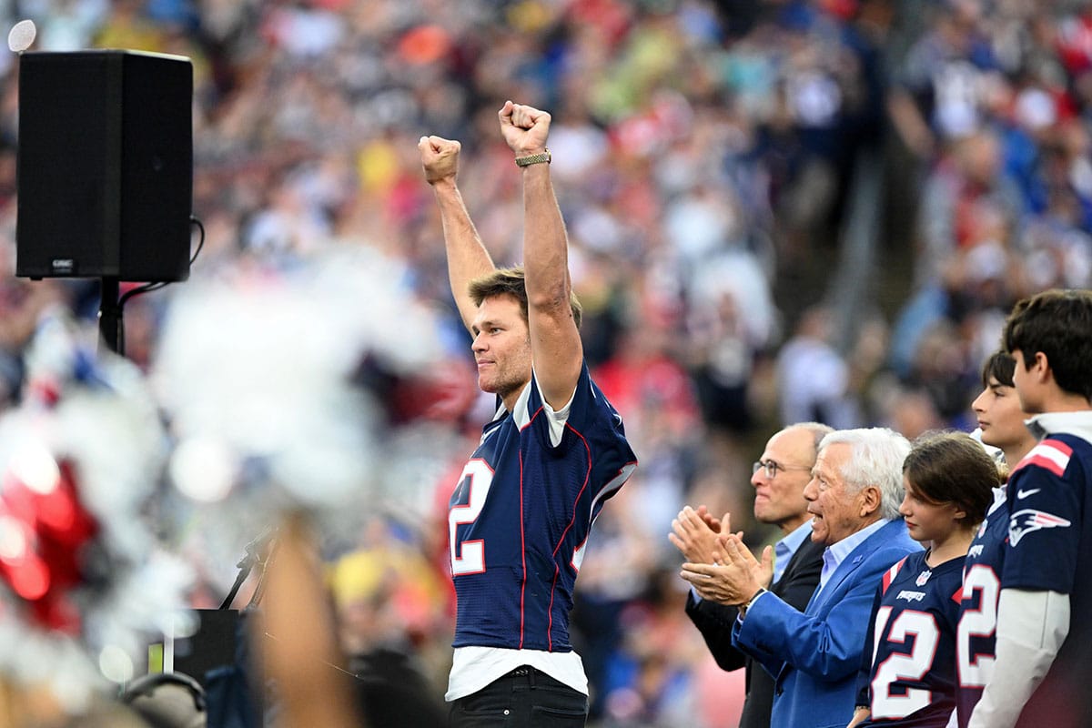 New England Patriots former quarterback Tom Brady gestures during a halftime ceremony in his honor during the game between the Philadelphia Eagles and New England Patriots at Gillette Stadium.