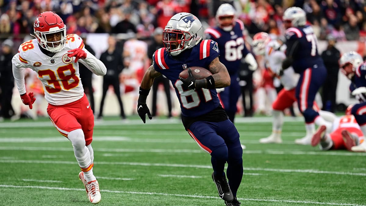 New England Patriots wide receiver Demario Douglas (81) runs the ball against the Kansas City Chiefs during the first half at Gillette Stadium. 