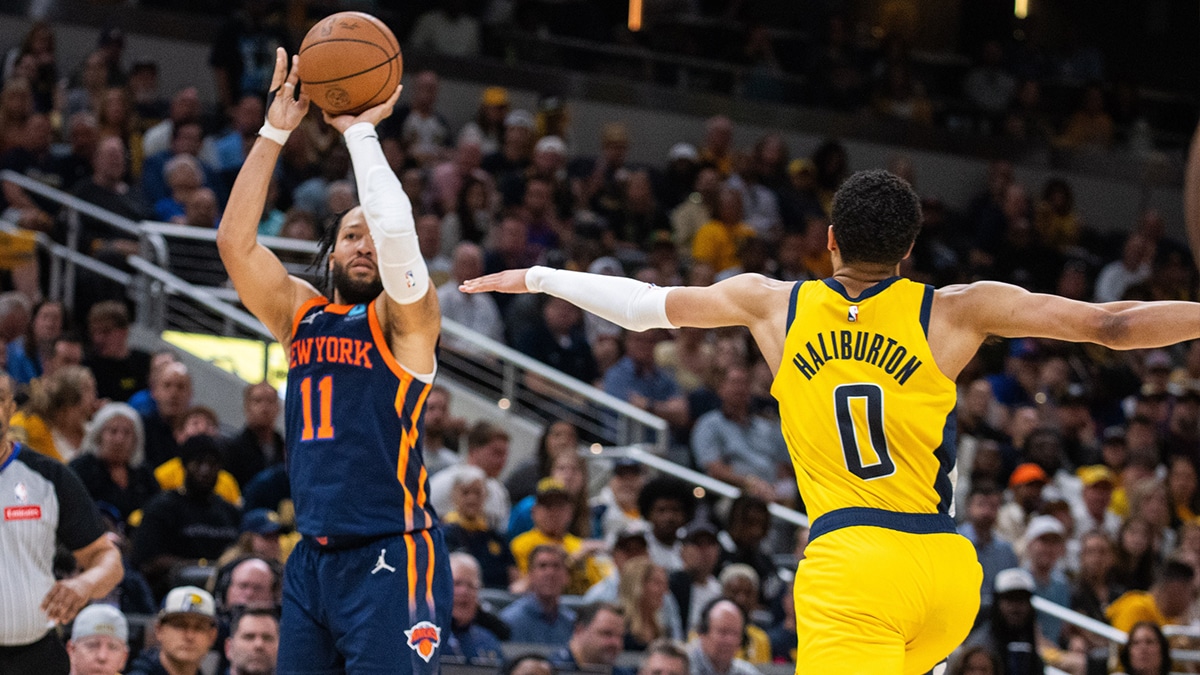 May 12, 2024; Indianapolis, Indiana, USA; New York Knicks guard Jalen Brunson (11) shoots the ball while Indiana Pacers guard Tyrese Haliburton (0) defends during game four of the second round for the 2024 NBA playoffs at Gainbridge Fieldhouse. Mandatory Credit: Trevor Ruszkowski-USA TODAY Sports