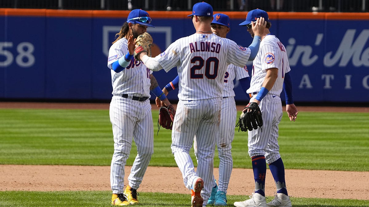 New York Mets third baseman Jonathan Arauz (19) and first baseman Pete Alonso (20) and shortstop Francisco Lindor (12) and second baseman Jeff McNeil (1) celebrate the victory after the game against the Pittsburgh Pirates at Citi Field.