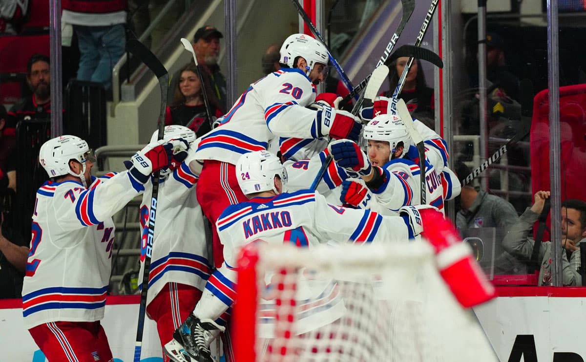 New York Rangers left wing Artemi Panarin (10) is congratulated by his teammates after his goal in the first overtime against the Carolina Hurricanes in game three of the second round of the 2024 Stanley Cup Playoffs at PNC Arena.
