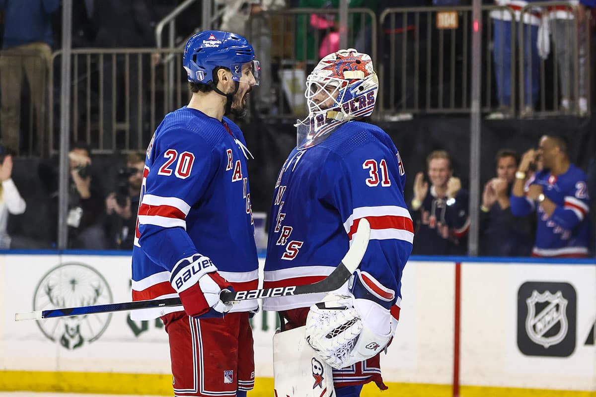 New York Rangers left wing Chris Kreider (20) and goaltender Igor Shesterkin (31) celebrate after defeating the Carolina Hurricanes 4-3 in game one of the second round of the 2024 Stanley Cup Playoffs at Madison Square Garden.