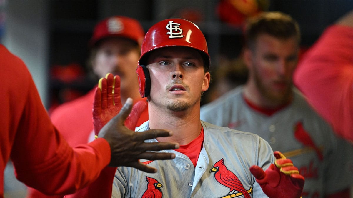 St. Louis Cardinals second base Nolan Gorman (16) celebrates in the dug out after hitting a home run against the Milwaukee Brewers in the ninth inning at American Family Field.