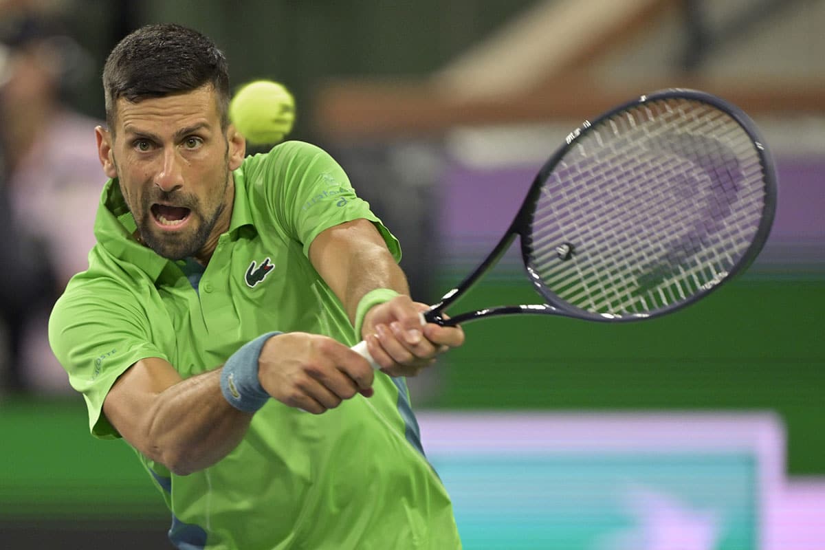 Novak Djokovic (SRB) hits a shot in his third round match against Luca Nardi (ITA) in the BNP Paribas Open at the Indian Wells Tennis Garden.