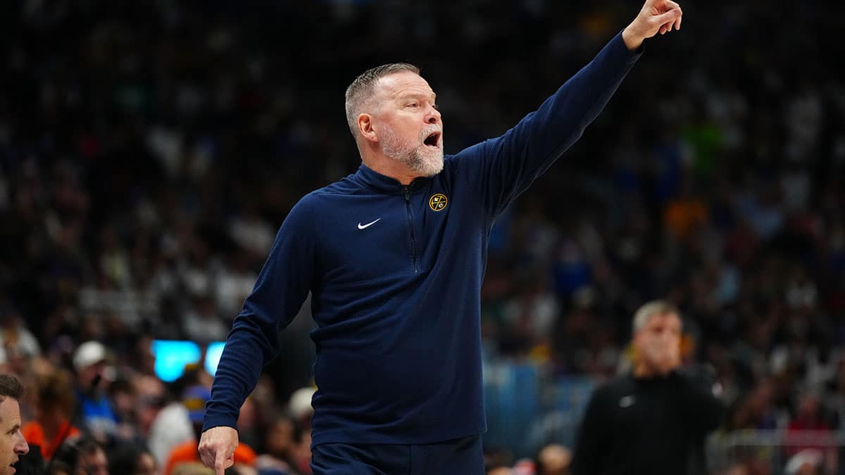 Denver Nuggets head coach Michael Malone calls out in the first quarter against the Minnesota Timberwolves in game seven of the second round for the 2024 NBA playoffs at Ball Arena. 