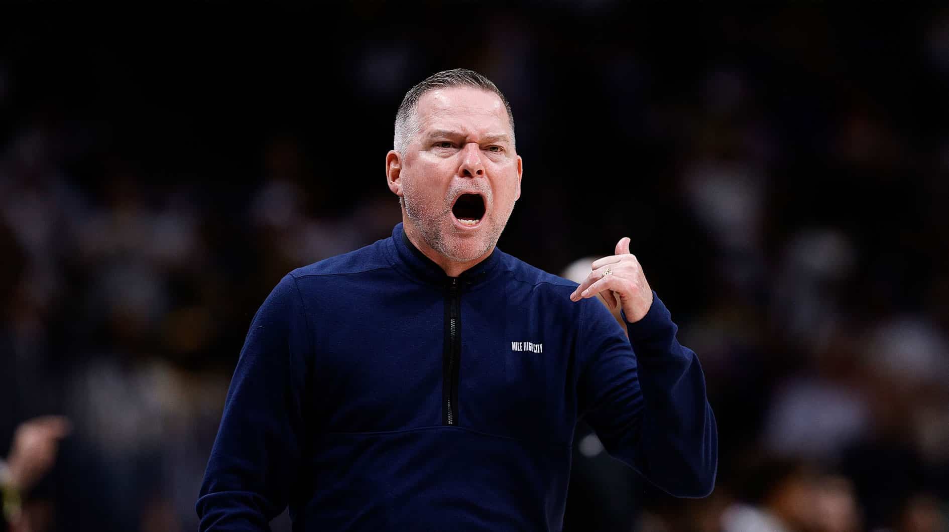 Denver Nuggets head coach Michael Malone gestures in the third quarter against the Los Angeles Lakers during game five of the first round for the 2024 NBA playoffs at Ball Arena. 