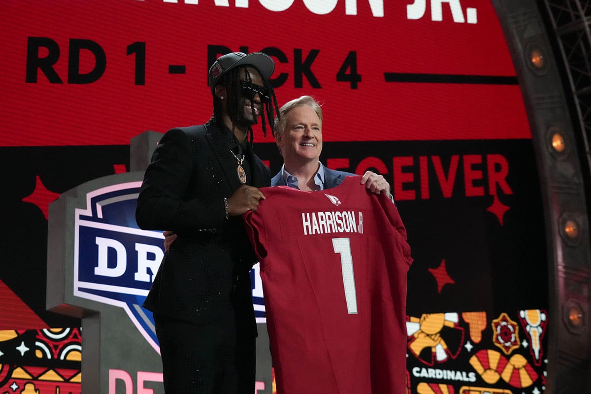 Ohio State Buckeyes wide receiver Marvin Harrison Jr. poses with NFL commissioner Roger Goodell after being selected by the Arizona Cardinals as the No. 4 pick in the first round of the 2024 NFL Draft.