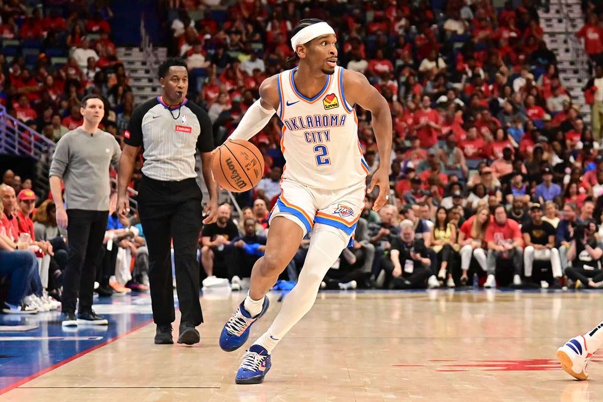 Oklahoma City Thunder Guard Shai Gilgeous-Alexander (2) handles the ball against the New Orleans Pelicans during the fourth quarter of game three of the first round for the 2024 NBA playoffs at Smoothie King Center. 