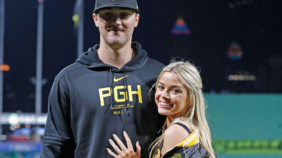Pittsburgh Pirates starting pitcher Paul Skenes (30) poses with his girlfriend Louisiana State University gymnast Olivia Dunne (right) after Skenes made his major league debut against the Chicago Cubs at PNC Park. 