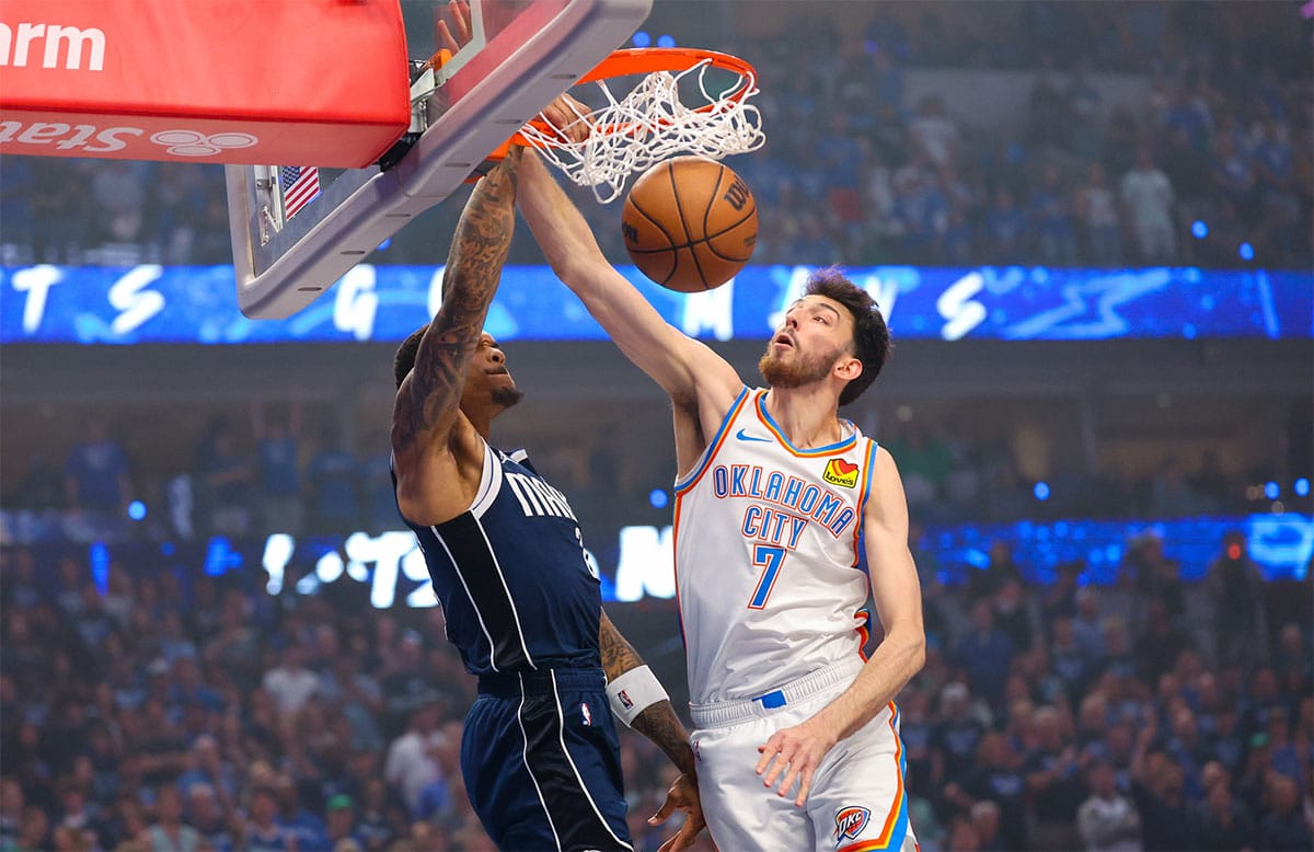 Dallas Mavericks forward P.J. Washington (25) dunks past Oklahoma City Thunder forward Chet Holmgren (7) during the first quarter during game three of the second round for the 2024 NBA playoffs at American Airlines Center.