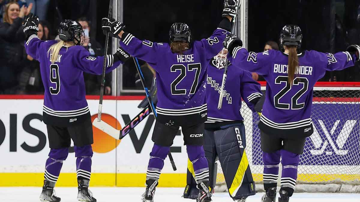 Minnesota players celebrate the win against Montreal after a PWHL ice hockey game at XCel Energy Center.