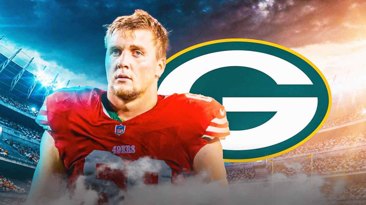 Spencer Waege next to Packers logo