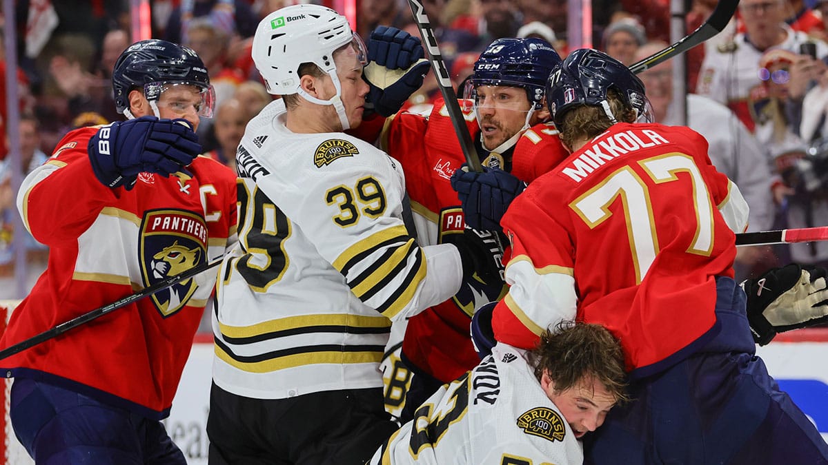 Florida Panthers center Sam Reinhart (13), center Aleksander Barkov (16) and defenseman Niko Mikkola (77) fight against Boston Bruins center Morgan Geekie (39) and defenseman Charlie McAvoy (73) during the third period in game two of the second round of the 2024 Stanley Cup Playoffs at Amerant Bank Arena.