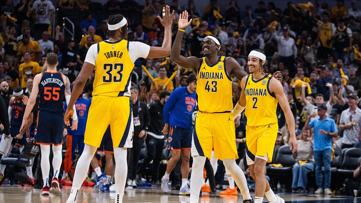 Indiana Pacers forward Pascal Siakam (43) and center Myles Turner (33) guard Andrew Nembhard (2) celebrate a made basket during game four of the second round for the 2024 NBA playoffs against the New York Knicks at Gainbridge Fieldhouse.