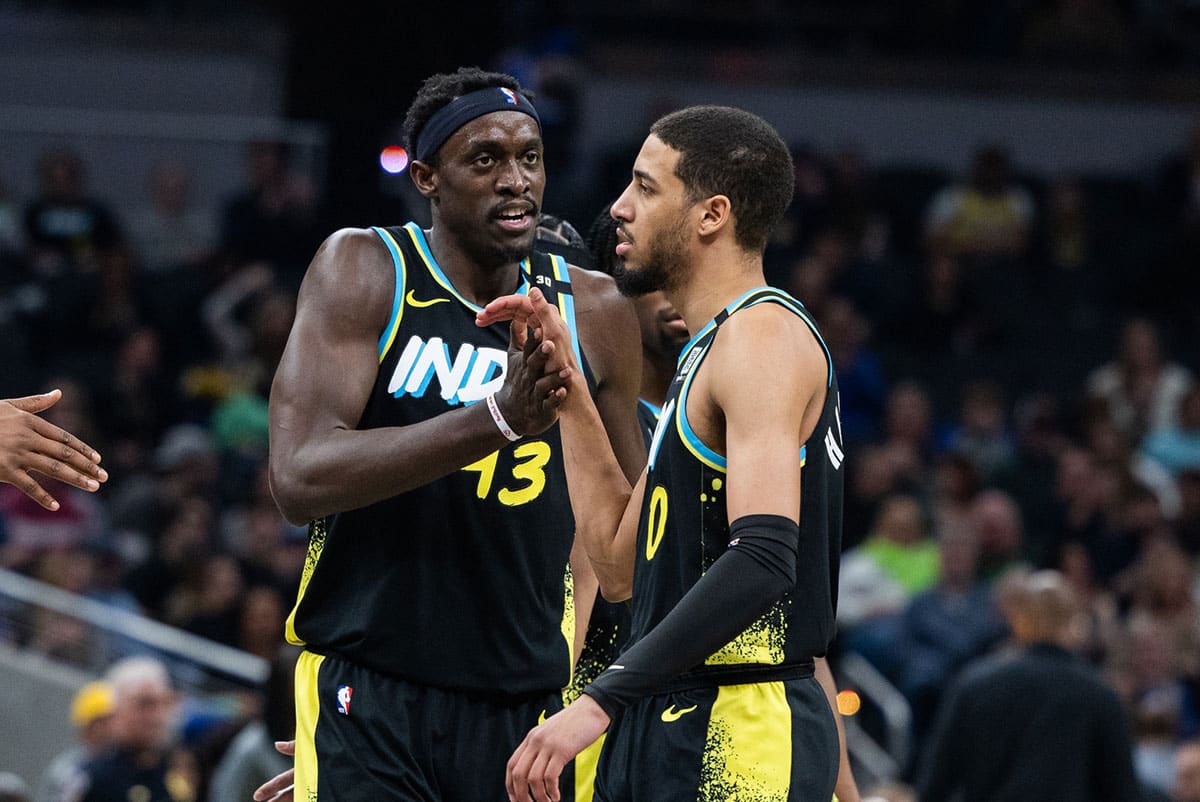 Indiana Pacers forward Pascal Siakam (43) celebrates with guard Tyrese Haliburton (0) in the first half against the Brooklyn Nets at Gainbridge Fieldhouse.