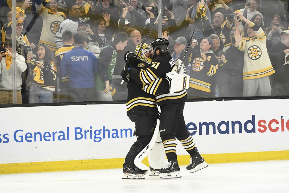 Boston Bruins goaltender Jeremy Swayman (1) and left wing Pat Maroon (61) celebrate after defeating the Toronto Maple Leafs in overtime in game seven of the first round of the 2024 Stanley Cup Playoffs at TD Garden