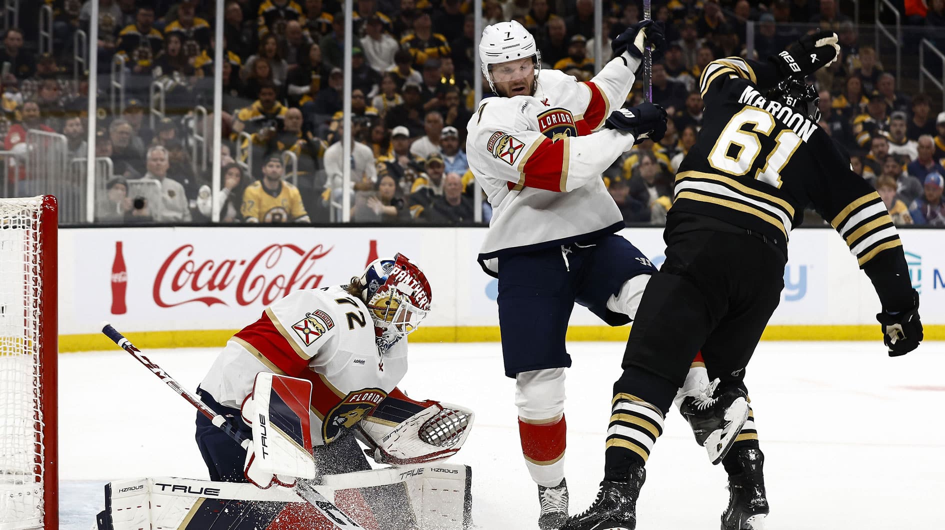 Boston Bruins left wing Pat Maroon (61) battles with Florida Panthers defenseman Dmitry Kulikov (7) in front as goaltender Sergei Bobrovsky (72) looks for a loose puck during the first period of game three of the second round of the 2024 Stanley Cup Playoffs at TD Garden.