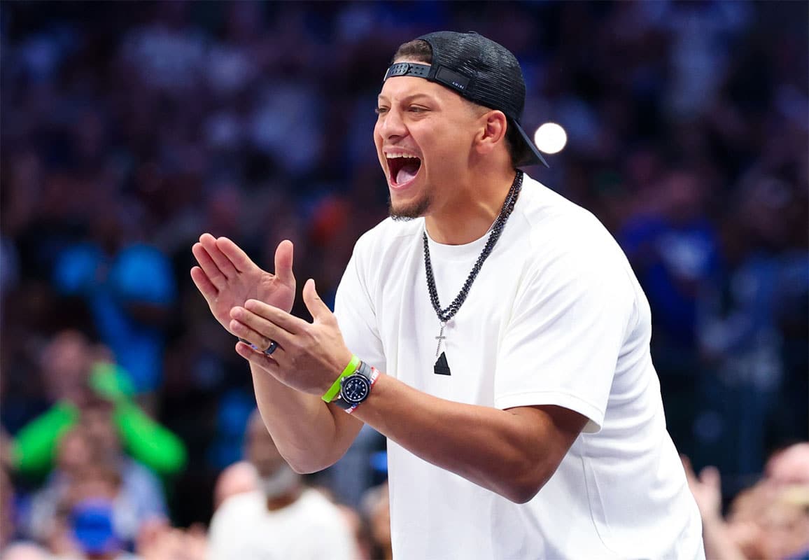 Kansas City Chiefs quarterback Patrick Mahomes II cheers during the game between the Dallas Mavericks and Oklahoma City Thunder during game three of the second round for the 2024 NBA playoffs at American Airlines Center.
