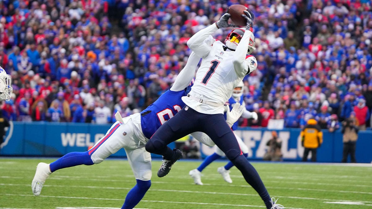 Dec 31, 2023; Orchard Park, New York, USA; New England Patriots wide receiver DeVante Parker (1) makes a catch against the Buffalo Bills during the first half at Highmark Stadium. Mandatory Credit: Gregory Fisher-USA TODAY Sports