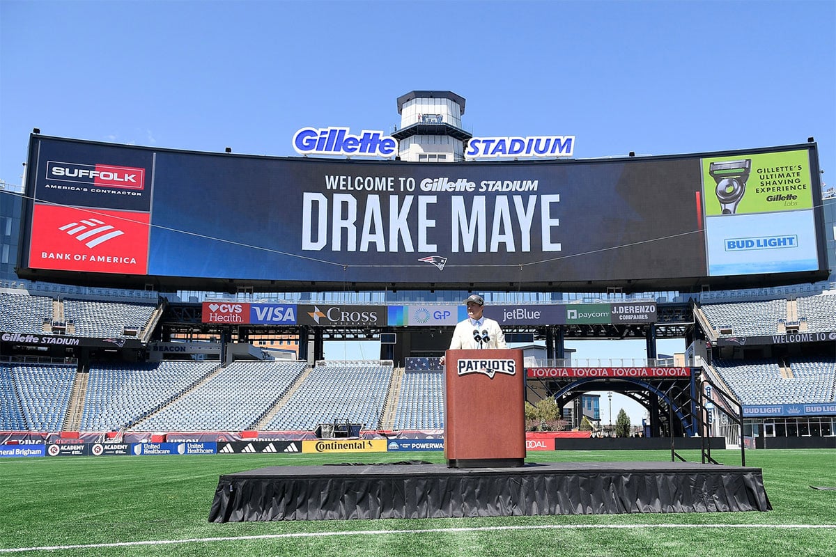 New England Patriots first round draft pick Drake Maye speaks to media on the game field at Gillette Stadium. 