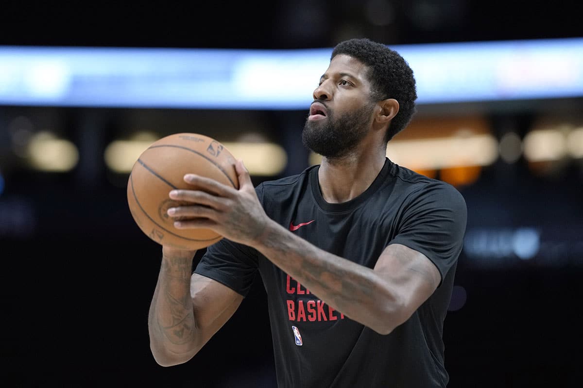 LA Clippers forward Paul George (13) warms up prior to a game against the Portland Trail Blazers at Moda Center.